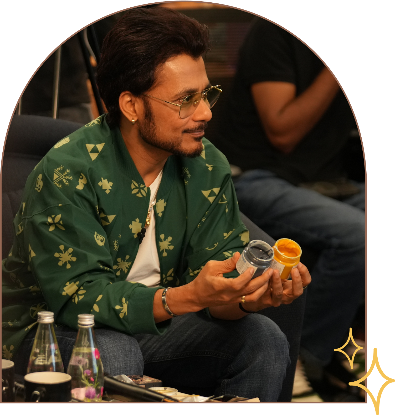 Anupam Mittal holding Everaw products at a Mesa School of Business event